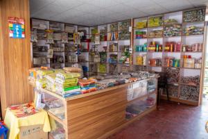 a store with a counter with many items on it at Hotel Sonam in Dhulikhel