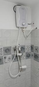 a shower in a bathroom with a hose at Villa Octopus in Maggona West +40 photos