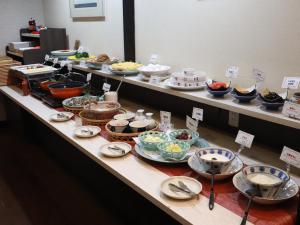 a buffet line with many different types of food at APA HOTEL Fukushima Ekihigasi in Fukushima