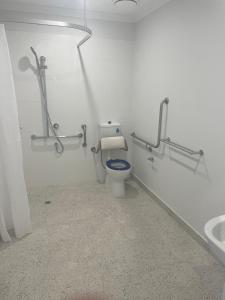 a bathroom with a toilet and a sink at Southern Retreat in Clyde North +11 photos