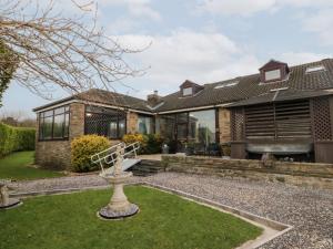 a house with a garden in front of it at Seacrest Lodge in Scarborough
