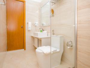 a bathroom with a toilet and a sink and a shower at Thundi by Biosphere in Maalhos +91 photos