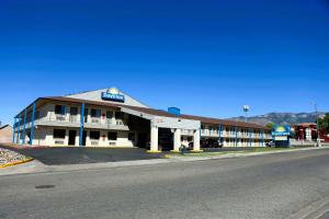 a building on the side of a road with a street at Days Inn by Wyndham East Albuquerque 'Newly Renovated' in Albuquerque