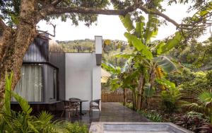 a house in the middle of a garden at CongLinLi Wooded Homestay in Conghua