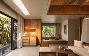 a living room with a couch and a table at CongLinLi Wooded Homestay in Conghua