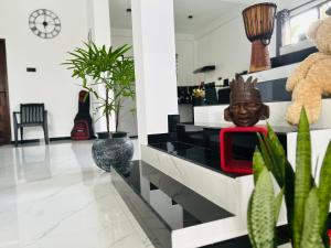 a living room with a black and white dresser at Dasis villa in Hiriketiya