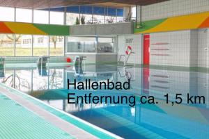 a swimming pool with the words halldrafted influencing cca on it at Bunnyhill in Elchingen