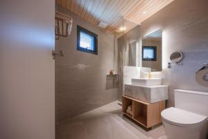 a bathroom with a white toilet and a sink at 롯지호텔 디여라 in Andong +9 photos