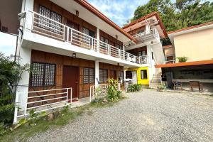 a building with a balcony on the side of it at Camp Saint John Hotel La Union in San Juan +47 photos