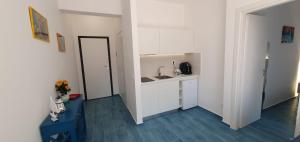 a small kitchen with a sink and a counter at BB Vista Mare - sea view in San Nicola Arcella +8 photos