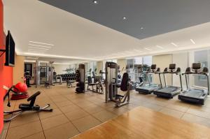 a gym with several treadmills and cardio machines at Hilton Lima Miraflores in Lima