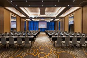 a conference room with rows of tables and chairs at Hilton Lima Miraflores in Lima +62 photos