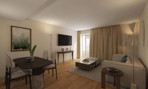 a living room with a couch and a table at Tivoli Coimbra Hotel in Coimbra
