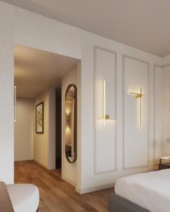 a bedroom with a bed and a cross on the wall at Tivoli Coimbra Hotel in Coimbra +19 photos
