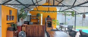a kitchen with a counter and a table in a room at Urban Farm Haus Guesthouse in Rundu
