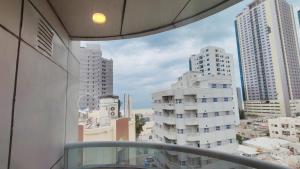 a view of a city from the balcony of a building at Al Khaleej Plaza Furnished Hotel Apartments in Ajman 