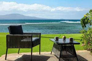 a table and a chair and a table and a table andheasternheasternheasternheastern at Lauloa 106 in Wailuku +25 photos