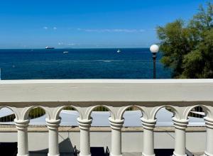 a view of the ocean from a balcony at Hotel Universal in Livorno