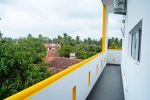 a balcony of a building with a view of trees at Lotus Luxury Residencies in Negombo