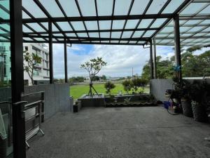 a patio with a view of a park at Migo Homestay in Yilan City