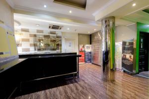 a large room with a piano in the middle at RedDoorz Plus near Simpang Tiga Tritayasa Cilegon in Cilegon