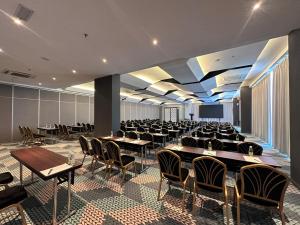 a large banquet hall with tables and chairs at 56 Hotel Block B in Kuching