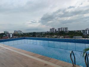 a large swimming pool on top of a building at 56 Hotel Block B in Kuching
