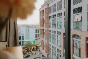 a view of a city street from a window at The Sun Avenue - TPHomes in Ho Chi Minh City