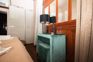a room with a green table in a room at Belga Boutique Panzió in Debrecen +101 photos
