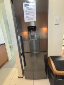 a stainless steel refrigerator with a water dispenser on it at GARDEN ON THE BEACH in Umdloti