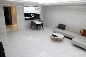 a living room with a couch and a table at W Residence Hotel Centum City in Busan