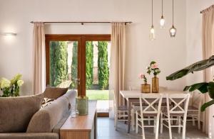 a living room with a couch and a table at Ville Borgo Verde in Vada