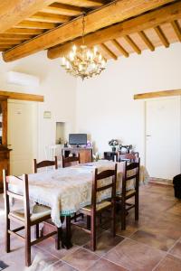 a dining room with a table and chairs at Locanda cireneo in Lugnano in Teverina +29 photos