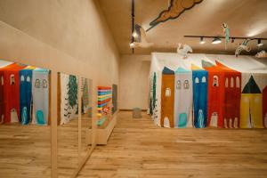 a room with paintings of surfboards on the wall at Kokhta Bakuriani in Bakuriani