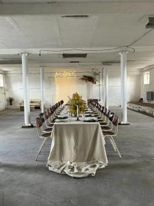 a large room with a long table and chairs at Rusiborek Slow in Murzynowo Kościelne +67 photos
