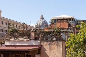 a group of buildings with a dome in the background at Palline Chalet by Hili in Rome