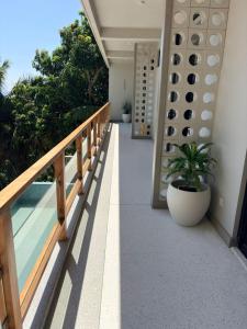 a balcony of a house with a plant at W15 Hiriketiya in Dickwella