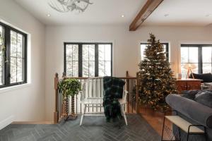 a living room with a christmas tree and a couch at Waterfront & Nature - Chalet Lac Clair in Entrelacs