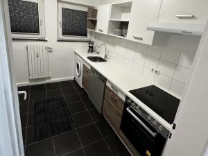 a small kitchen with a sink and a dishwasher at Apartment in Bergkamen in Bergkamen