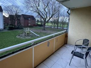 a balcony with a view of a playground at Apartment in Bergkamen in Bergkamen