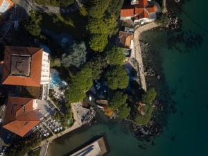 an overhead view of a house and the water at Amadria Park Hotel Milenij in Opatija