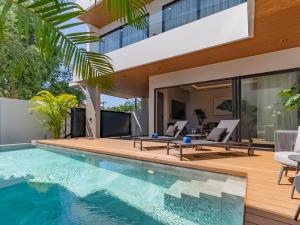 an image of a house with a swimming pool at Dara Villas - Rawai in Rawai Beach