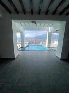 a swimming pool with a view of a city at Ambassador Garden Home in Kathmandu