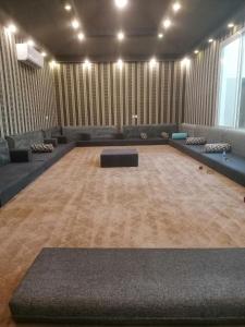 a large room with couches and a table in the middle at IN 2 Chalet in Jeddah +22 photos