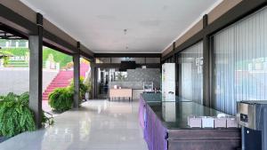 a kitchen and living room with a counter in a house at Mata Ie Resort in Sabang +18 photos
