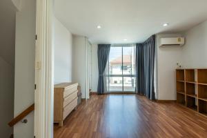 a living room with a wooden floor and a large window at Spacious 3BR BKK NEAR 3 Private Bathrooms FAMILY STAY in Min Buri +26 photos