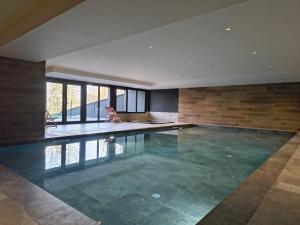 a swimming pool in a house at Alpine Blanc - Neuf, calme & Wellness in Saint-Gervais-les-Bains