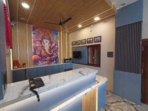 a room with a reception desk with a phone at Hotel Padma Residency in Datia