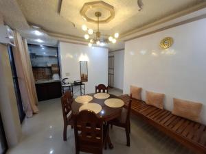 a dining room with a table and chairs at Imari's Apartment in San Isidro