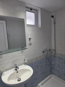 a bathroom with a sink and a shower at Mojo Hotel Laganas Zante in Laganas